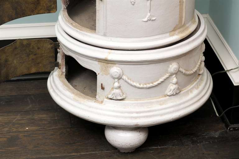 A late 19th century European decorative stove with glazed ceramic and finial decoration at the top. For decorative use only.