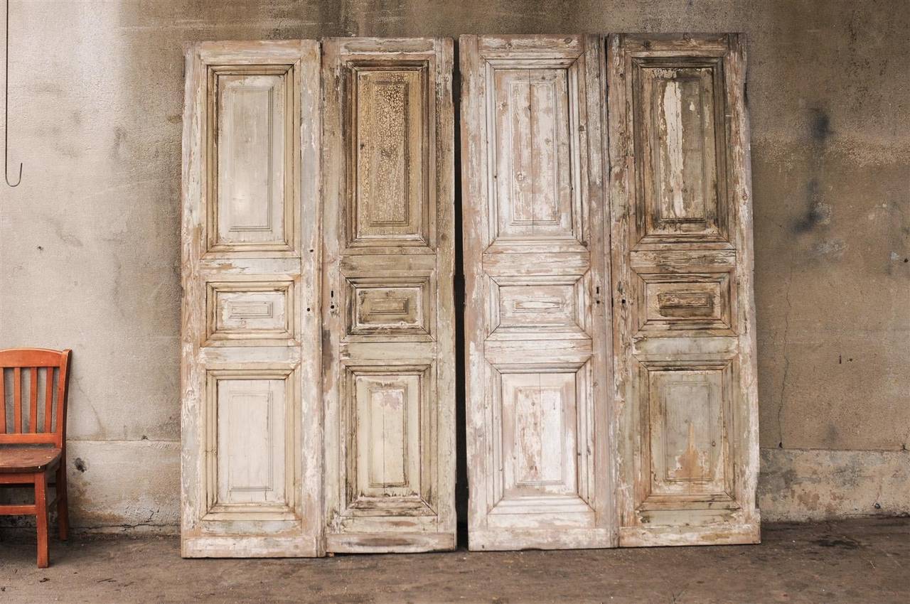 A Pair of  19th Century French Wooden Doors with Carved Panels. 2 Pairs Available and Photographed Here in the Main Picture (Pair B and Pair C), Sold and Priced per Pair. Perfect to put on a rail.

Left (Pair B): 51.25