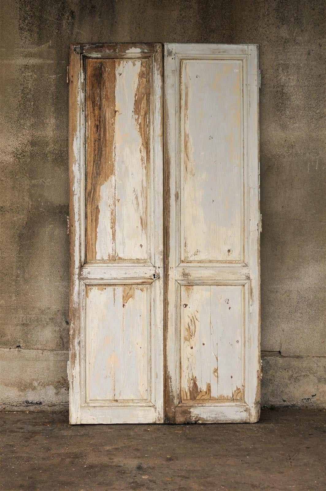 A pair of 19th century French painted wood doors, distressed look. They would be perfect installed on rails to separate rooms.