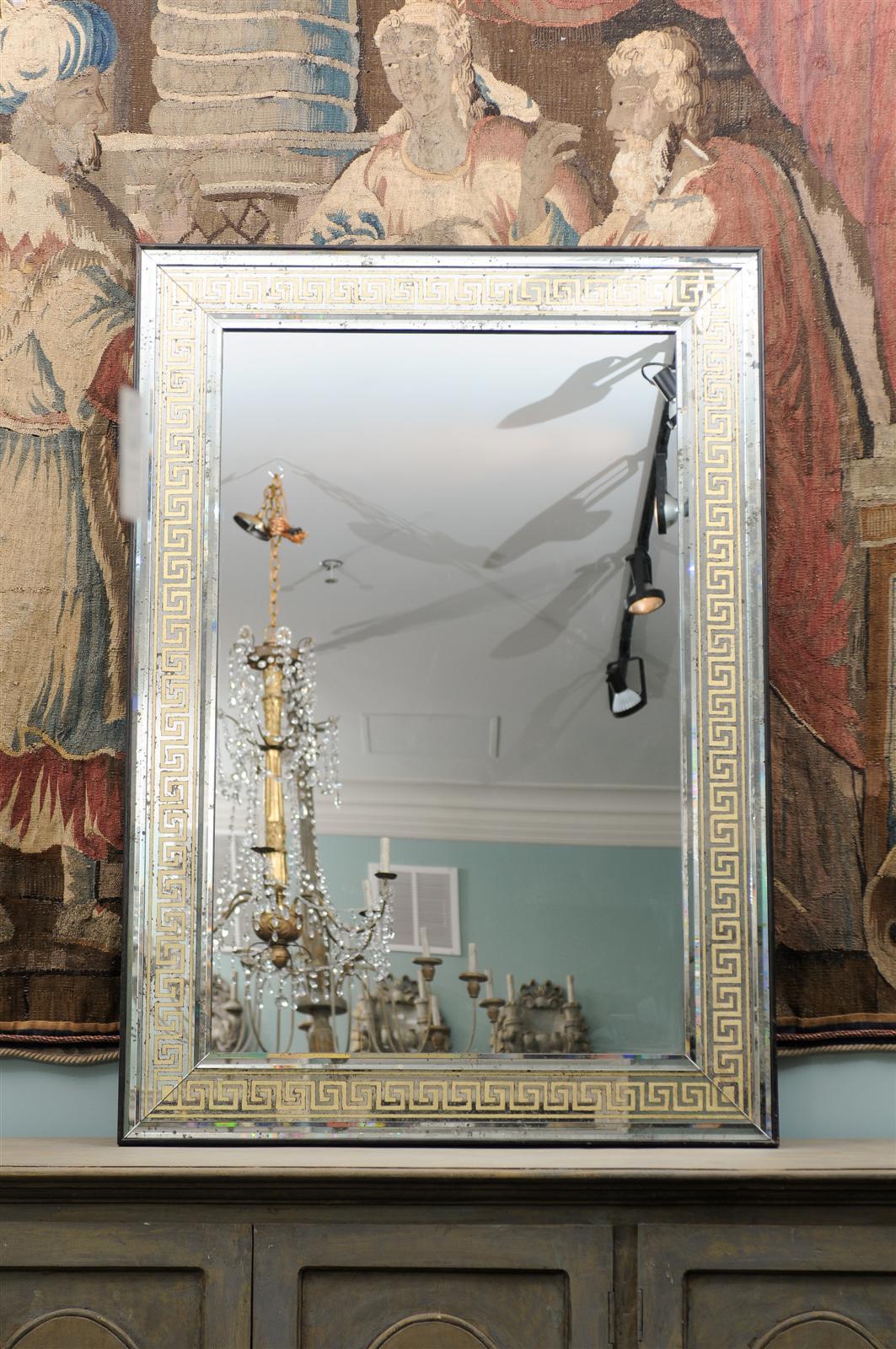 An Exquisite Large Scale Mirror with Eglomisé Greek Key Motif in the Surround.