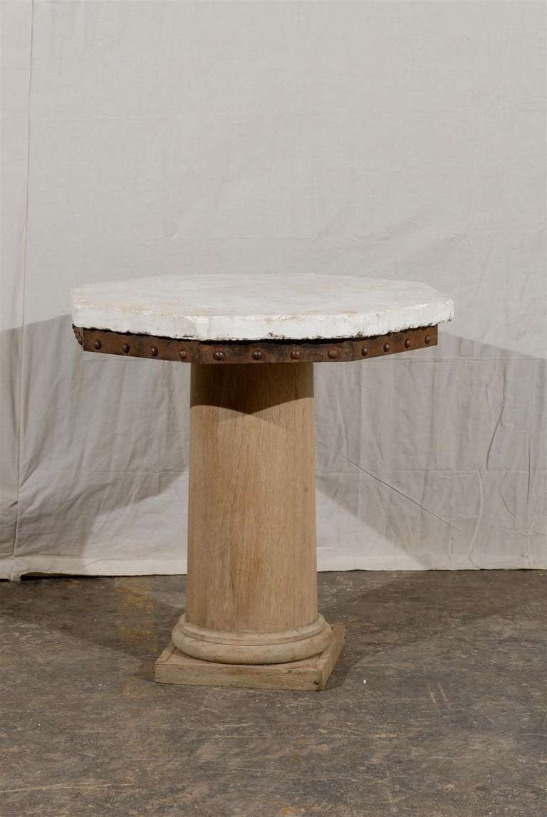 An American Bleached Oak and Coquina Stone Top Pedestal Center Table from the Early 20th Century (Later Top).