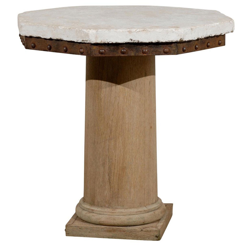 A Bleached Oak With Stone Top Pedestal Center Table