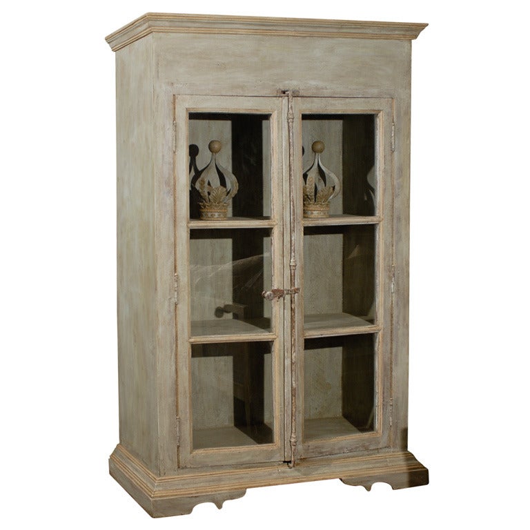 A Painted Wooden Bookcase with Glass Doors