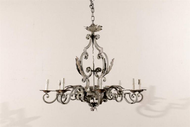 A French Vintage Eight-Light Painted Iron Chandelier with Scroll Arms and Foliate Motif, rewired for the US.