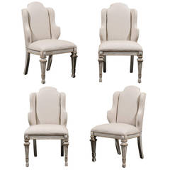 A Set of Four Italian Painted Wood Wingback Chairs