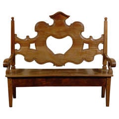 A Richly Carved Brazilian Wooden Bench