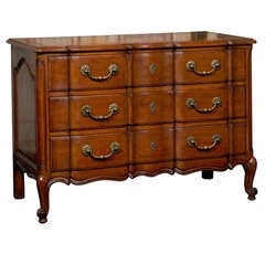 A Three-Drawer Chest with Leather Covered Sliding Top