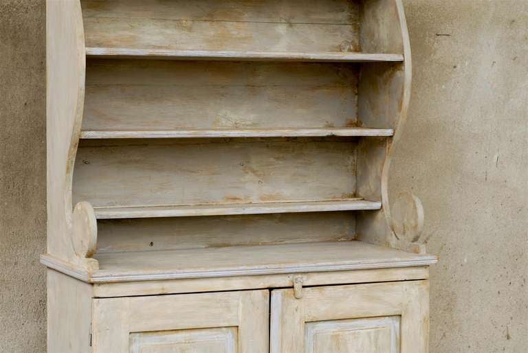 A European Painted Wood Bookshelf With Opened Shelves Over Two Doors at