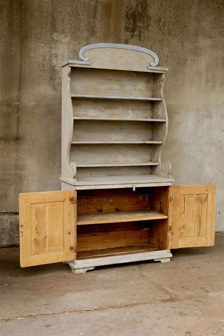 A European Painted Wood Bookshelf With Opened Shelves Over Two Doors at