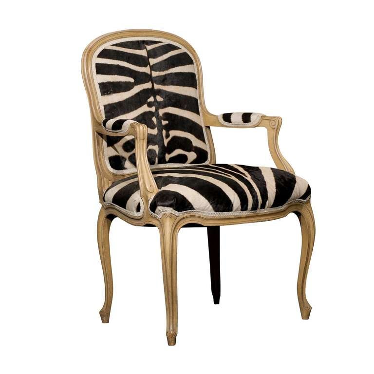 A French Louis XV style Bergère Chair upholstered with zebra skin. Painted Wood, Nice Cabriole Legs.
