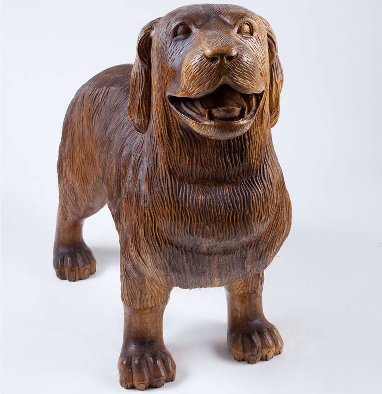Delightful hand carved wooden dog, probably German standing on all fours with open happy mouth.