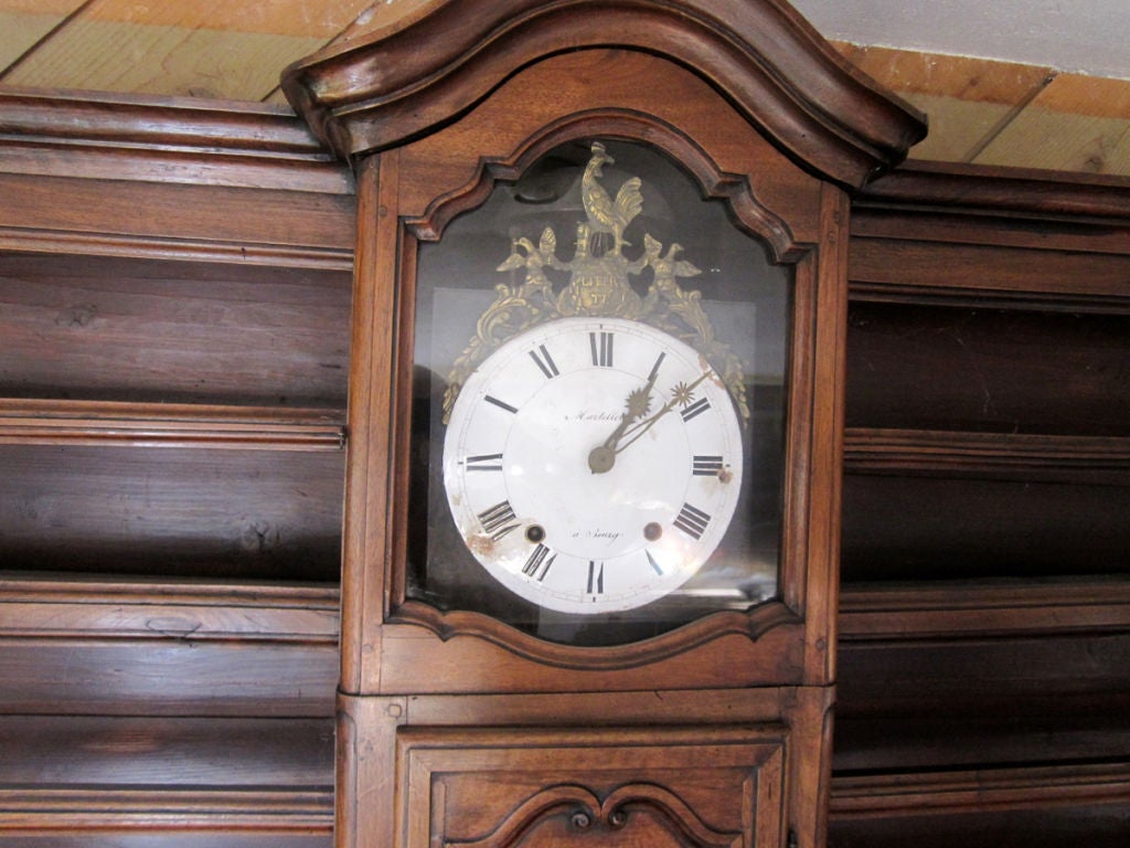 French Régence-Provincial Walnut Vaisselier Featuring A Central Clock For Sale 1