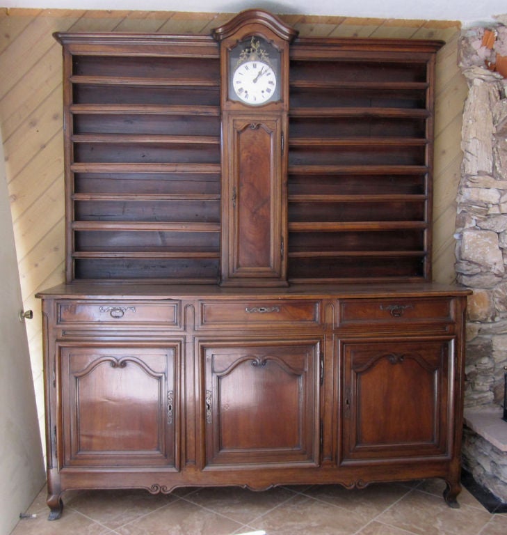 French Régence-Provincial Walnut Vaisselier Featuring A Central Clock For Sale 4