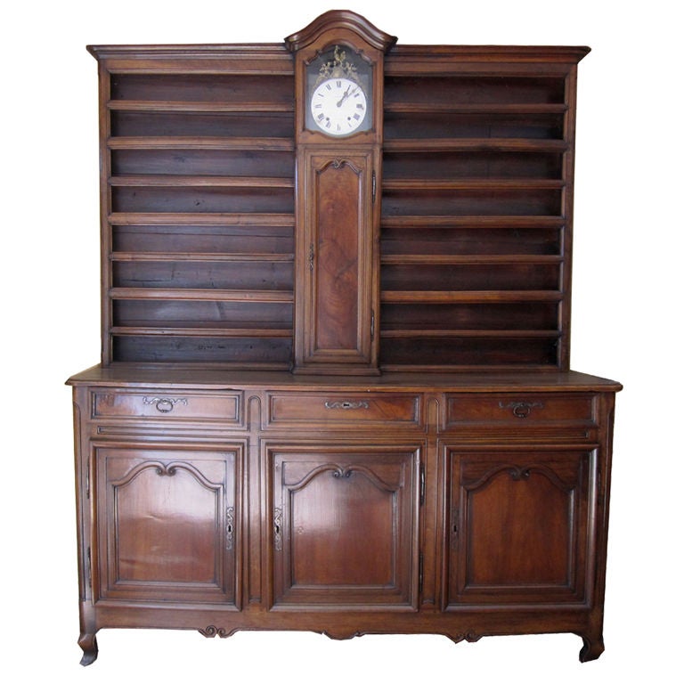 French Régence-Provincial Walnut Vaisselier Featuring A Central Clock For Sale