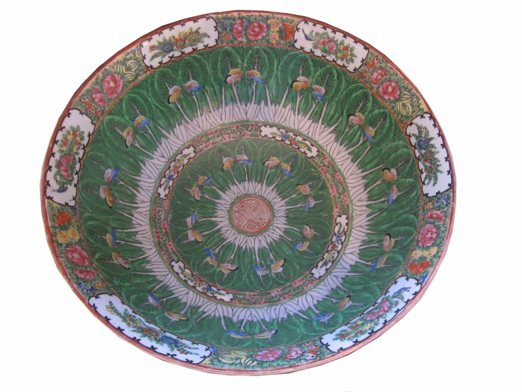 An important Chinese Export porcelain bowl in the cabbage leaf pattern with butterfly and famille rose decoration on inner & outer rims, the bottom interior with a gold leaf Chinese monogram. Accompanied with a carved wooden stand.