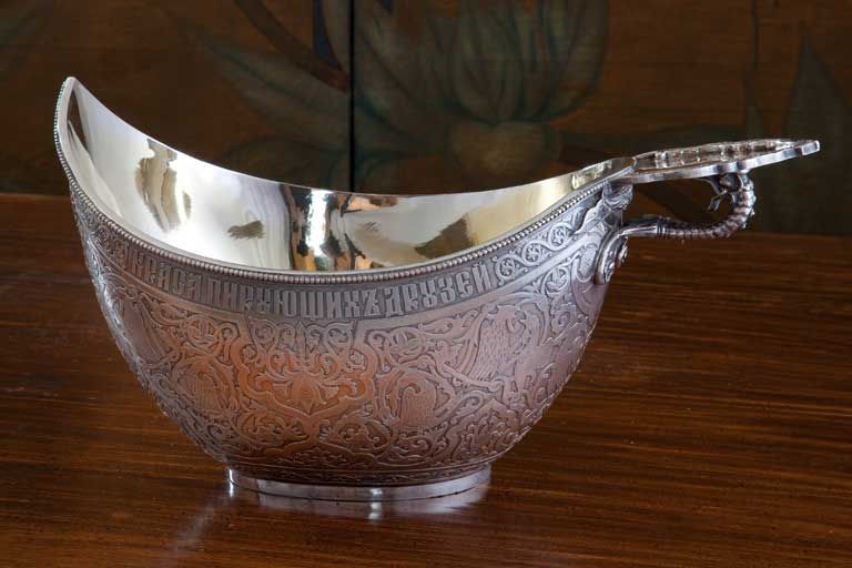 .875 Fineness Russian Imperial Silver bowl, - kovsh with gilt interior, made by Michael Ovchinnikov famous Russianmaster who worked in Moscow 1835-1882 (marked below the handle).  The exterior ornate with different Russian mythological figures, the