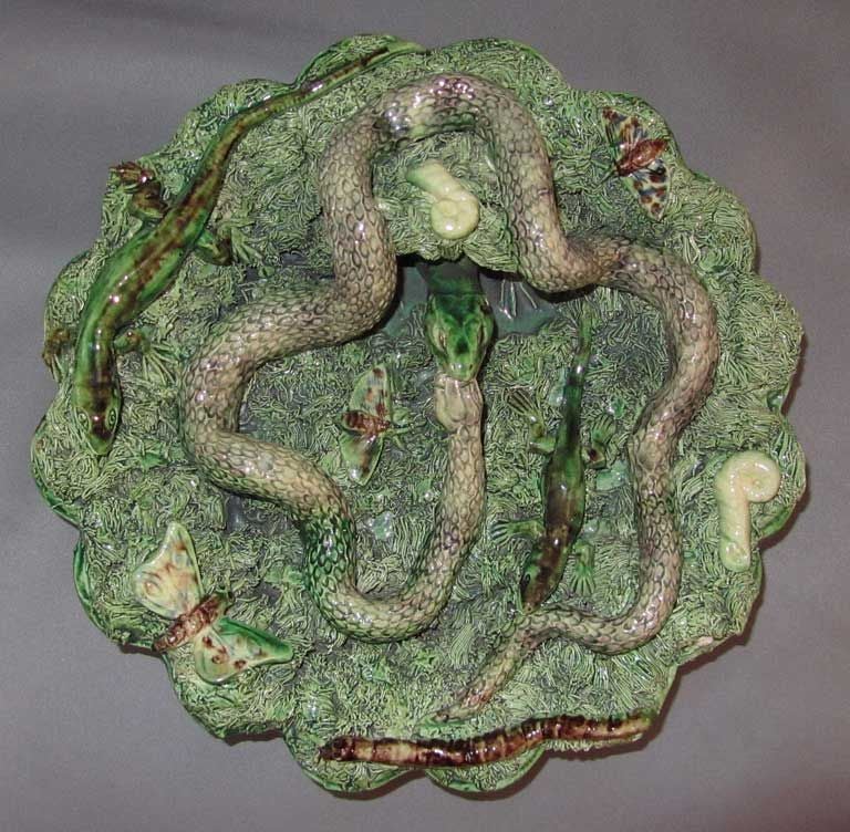 Fabulous 19th Palissy Ware wall plate signed by Jose A. Cunha from Caldas da Rainha, Portugal.  The plate decorated with serpent, lizards, butterflies, snails and a worm in the grass of scalloped plate.