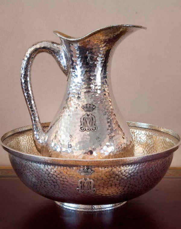 This magnificent monumental French 1st standard .950 silver hand hammered pitcher and bowl by renowned silversmith Gustav Keller of Paris was made circa 1900-1910.  Pitcher and bowl with crowned 'M' monogram with Provenance from Estate of Tom Mix.