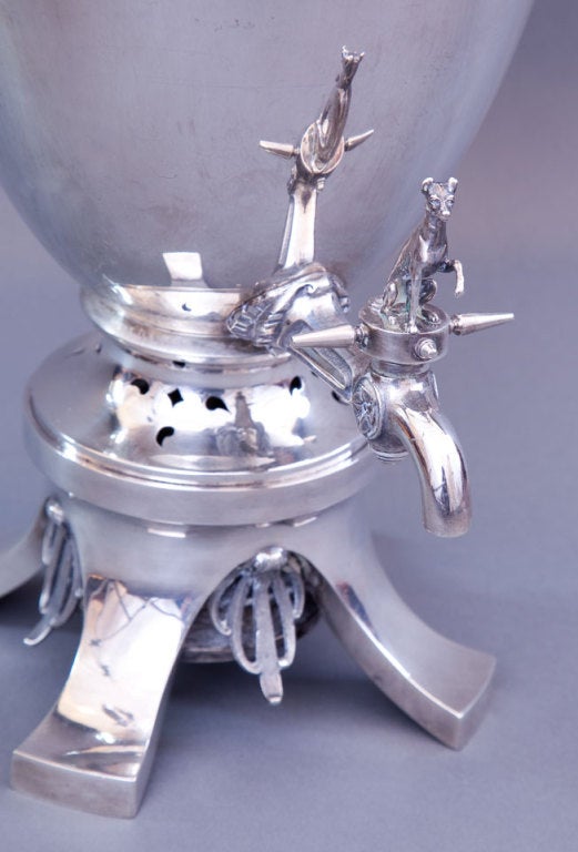 A fine American Victorian sterling amphora form hot water urn and cover, Bailey & Co. Designed in the Neo-Classic or “Neo-Greek” revival style; the body detailed with large looping handles and encircled by a keyfret band; the spigot surmounted by a