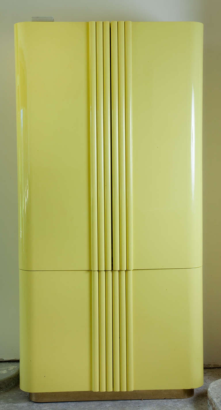 This Custom made J. Robert Scott Vintage stunning
lacquered lemon yellow armoire, was made in the
last half of the 20th century. The fluted doors open
to reveal upper and lower cabinet with pull out
swivel platform.