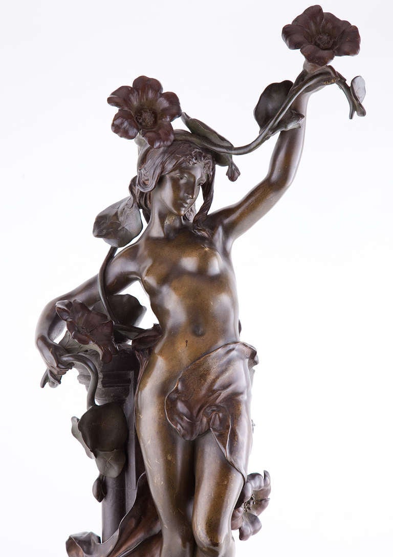 Fine late 19th century Art Nouveau bronze by Jean Baptiste Germain, French (1841-1910), depicting a beatuiful standing woman leaning against a pedestal holding and entwined with vines of flowers, signed Germain B.
