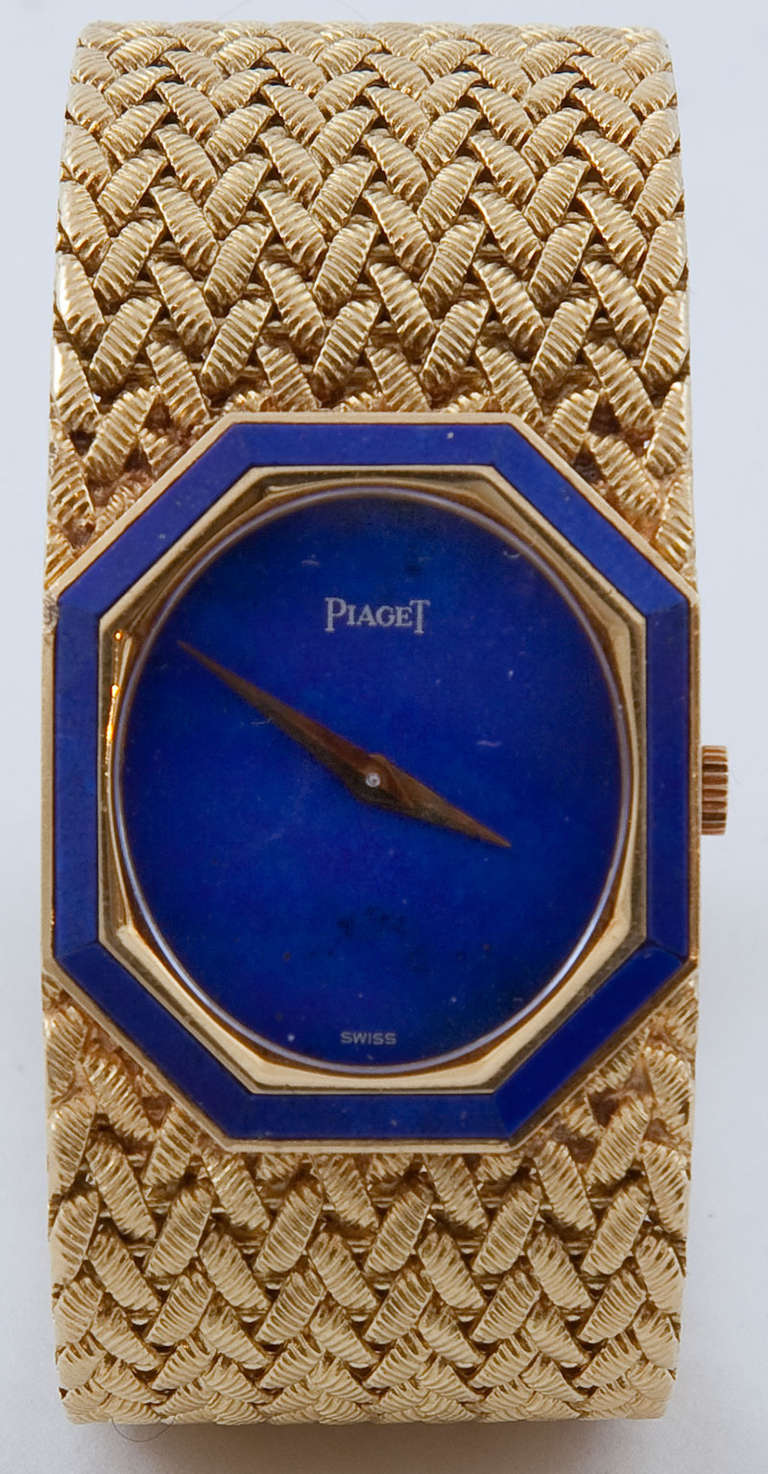 A ladies Piaget gold wristwatch manual, oval lapis lazuli dial, signed case, dial and movement, 18k gold elongated octagonal case set with lapis lazuli to the bezel, 18k gold bracelet bands. Circa 1970.