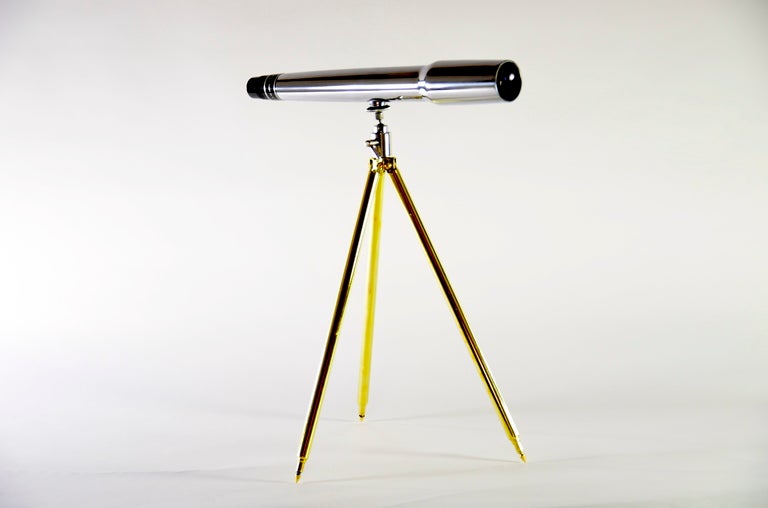 Handsome polished aluminum spotting scope on telescoping brass tripod. Excellent eye candy for the desk! 20X magnification. Height fully extended is 48
