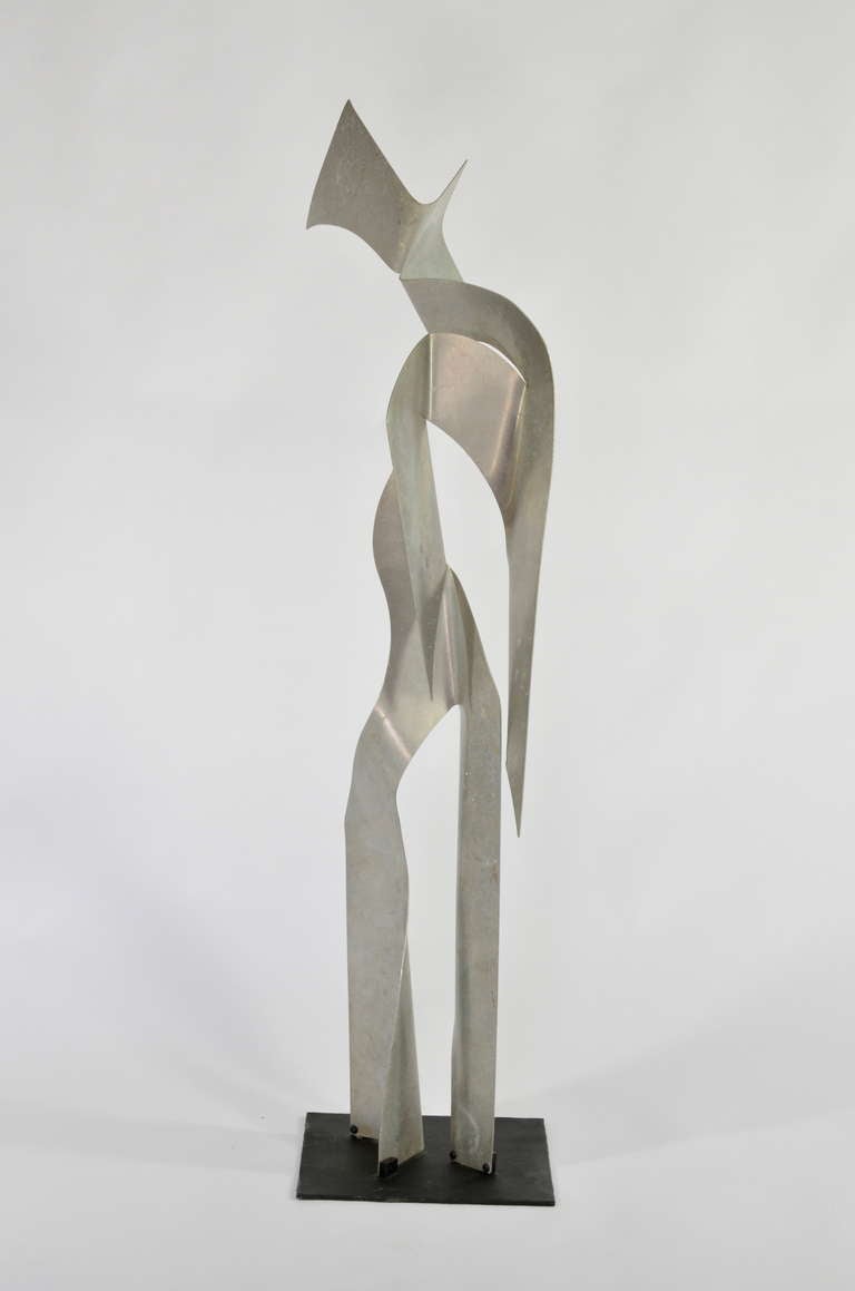 Life size sculpture rendered in artfully folded
aluminum. This piece is by local bay area artist, John Chase Lewis 1924-2013. Mr. Lewis enjoyed a long industrious career spanning decades. He was a student of sculpture and later a teacher,