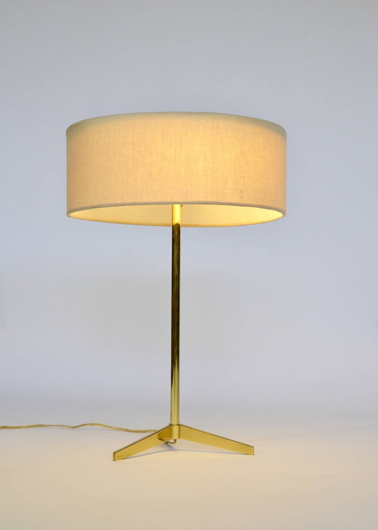Classic brass tripod table lamp by Paul McCobb. Simple and elegant iconic form.

Please feel free to contact Polished Modern directly for best pricing and shipping options.