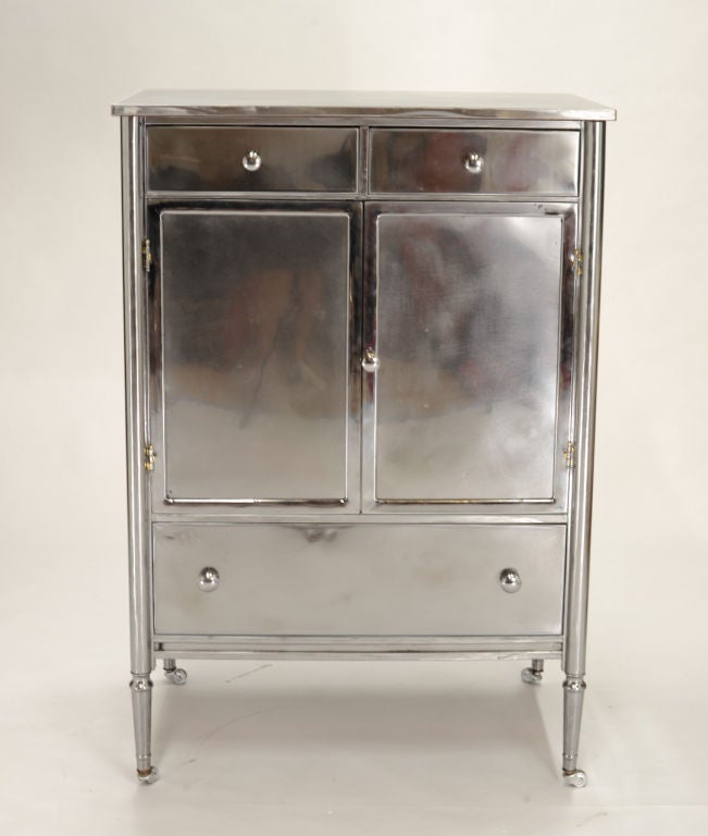 A wonderful chest of drawers.  The insides have been painted white and the outsides are a polished steel wih a clear cover of lacquer.  a handsome addition to any room.