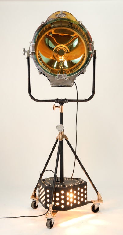 A huge Laco Stage light with a Bausch and Lomb len.  The accents have been polished on the light and the brass on the base.  The base is a wonderful starlight tripod base.  Truely a glamourous light. The light head measures 27