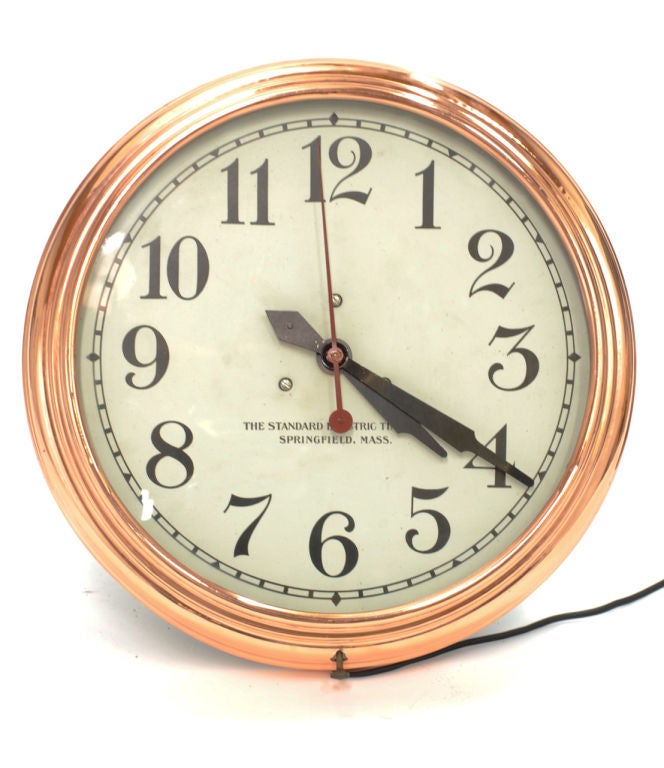 Gleaming industrial era copper wall clock by Standard Electric Time Company. Polished solid copper housing. New electric movement . Clock face is 12