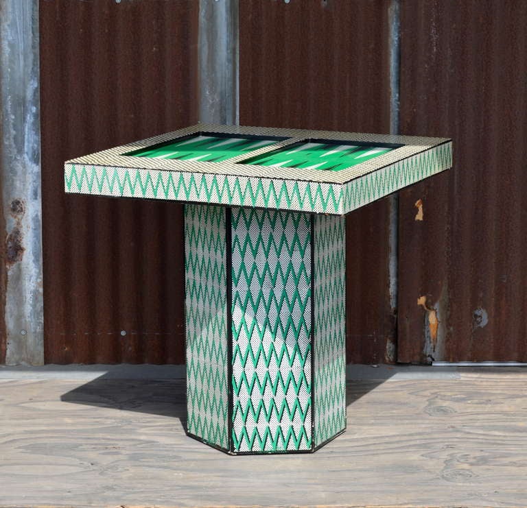 This awsome backgammon table definatly has a vibe. Very graphic geometric hand applied finish in a trippy color sceme make this the ultimate conversation peice.