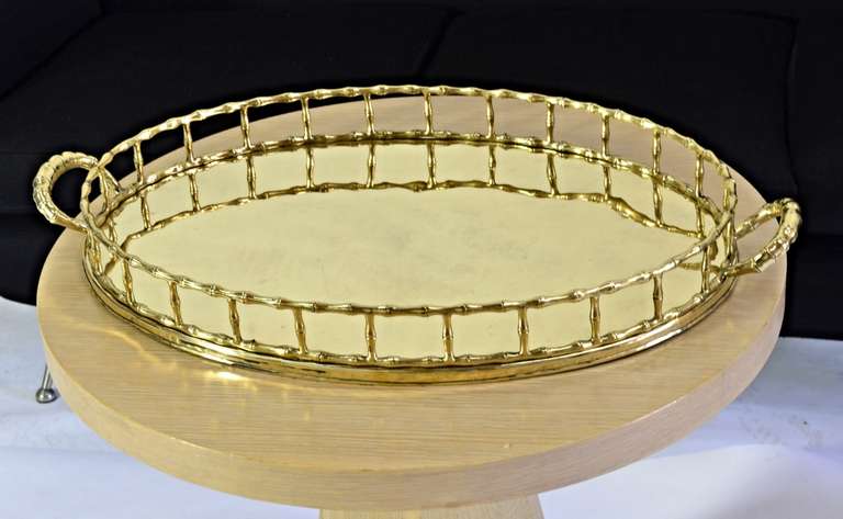 Large solid brass serving tray with faux bamboo detail. Trays always bring order to chaos. With its raised brass edge, this tray is perfect as a bar-top accessory.
Please feel free to contact me directly for best pricing and shipping options.