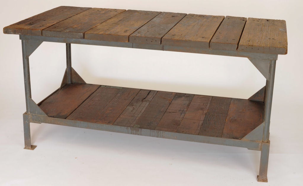 This rustic metal and wood work table is big on character. Excellent for use as a retail gondola.