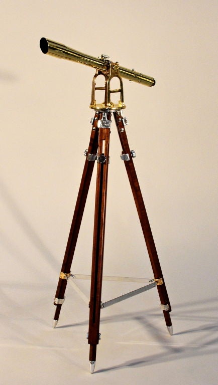 Vintage brass surveyer's telescope mounted to a wood tripod with aluminum fittings. Very nice optics and great use of mixed metals.