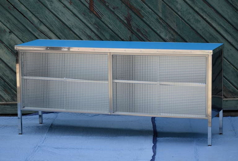 Built to last, this credenza is made by Steelcase, USA. This is a rare extended version. NIce blue formica top is from Abet Laminatti #499 SEI. I am offering a matching single bank tanker to complete the look, please inquire.