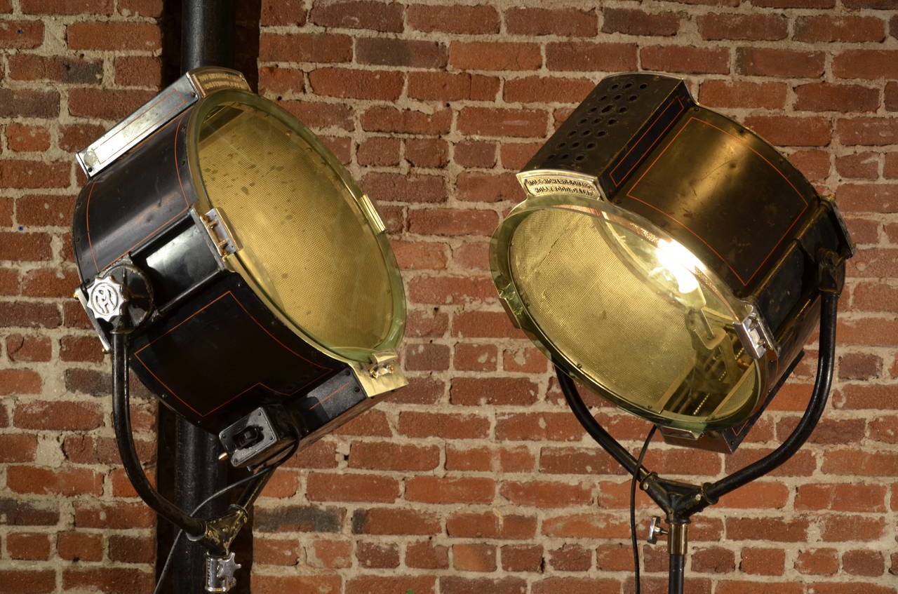 From the golden age of Hollywood, these handsome industrial stage lightS make a dramatic appearance. Bases are adjustable from 66
