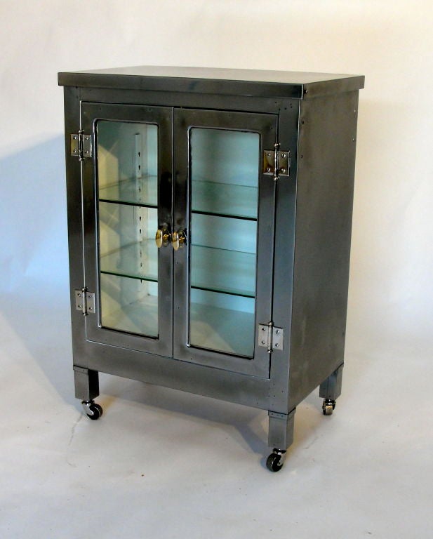 Handsome steel medical cabinet featuring freshly enameled  interior, and polished and sealed exterior. Excellent build quality, 2 glass sheaves.