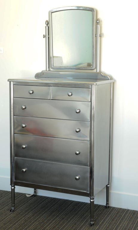 Handsome steel tallboy dresser with attached vanity mirror. Mirror is 24.5