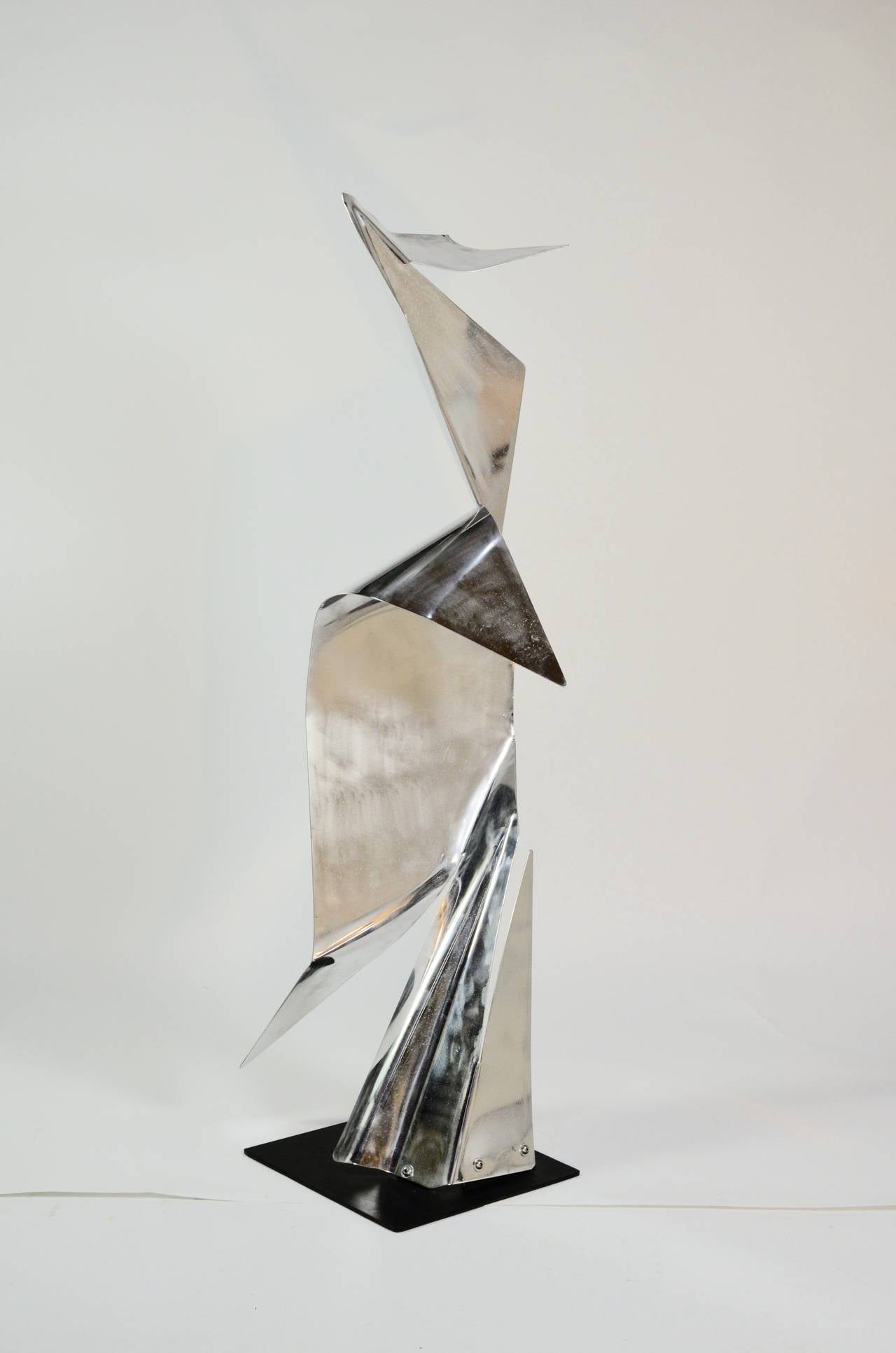 Lifesize sculpture rendered in artfully folded,
aluminium. This piece is by local bay area artist, John Chase Lewis 1924-2013. Mr. Lewis enjoyed a long industrious career spanning decades. He was a student of sculpture and later a teacher,