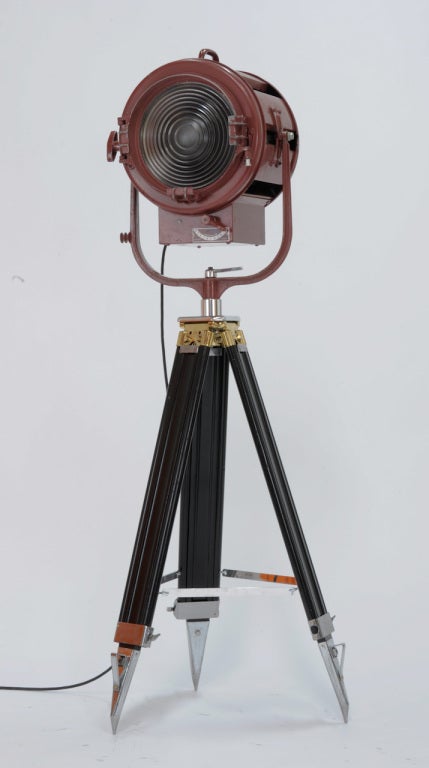 Nice film spot light married to wood tripod. Lamp is fitted with incandescent bulbs, 110 electrical, ajustable intensity and tripod height. Pair available. Priced individually.