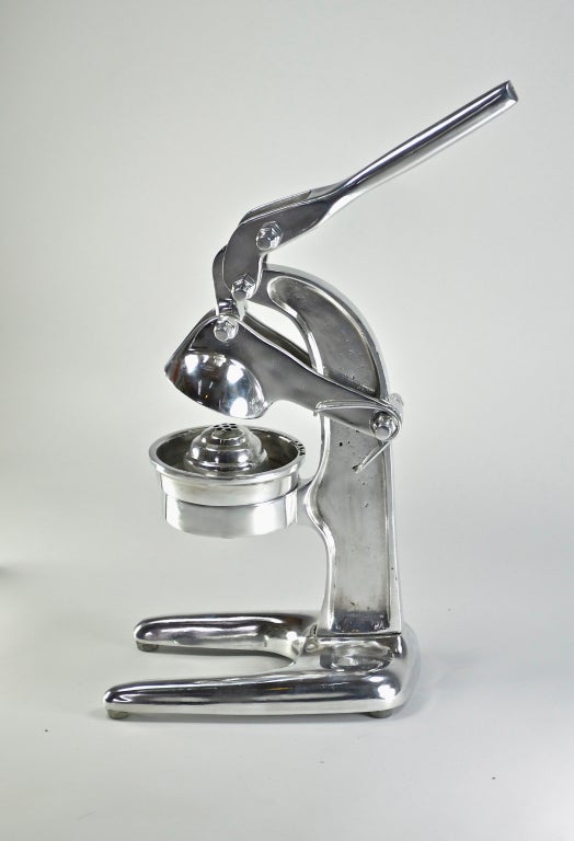 Polished aluminum citrus press. Simply a beautiful countertop accessory.