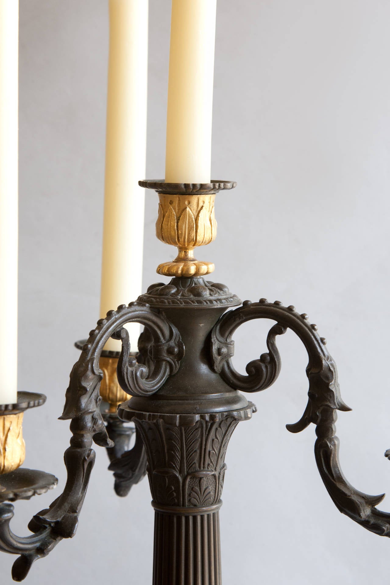 Pair of Restauration Four-Arm Gilt and Patinated Bronze Candelabra