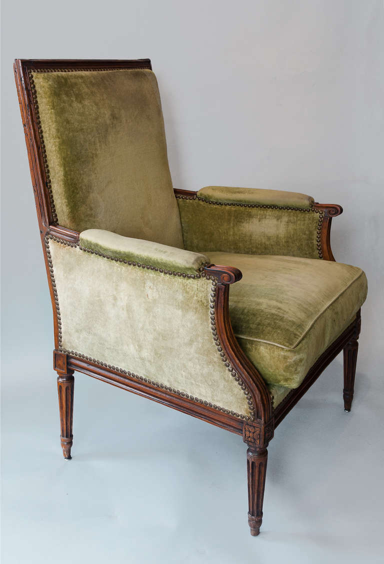 Carved beech frame with square back and fluted legs. Later 19th Century upholstery of green velvet.

Please note we are members of LAPADA and CINOA.