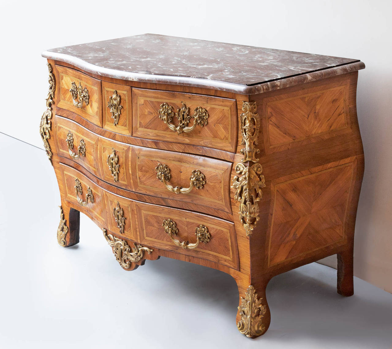 Louis XV Gilt Bronze Mounted Tulipwood and Olive Bombé Commode