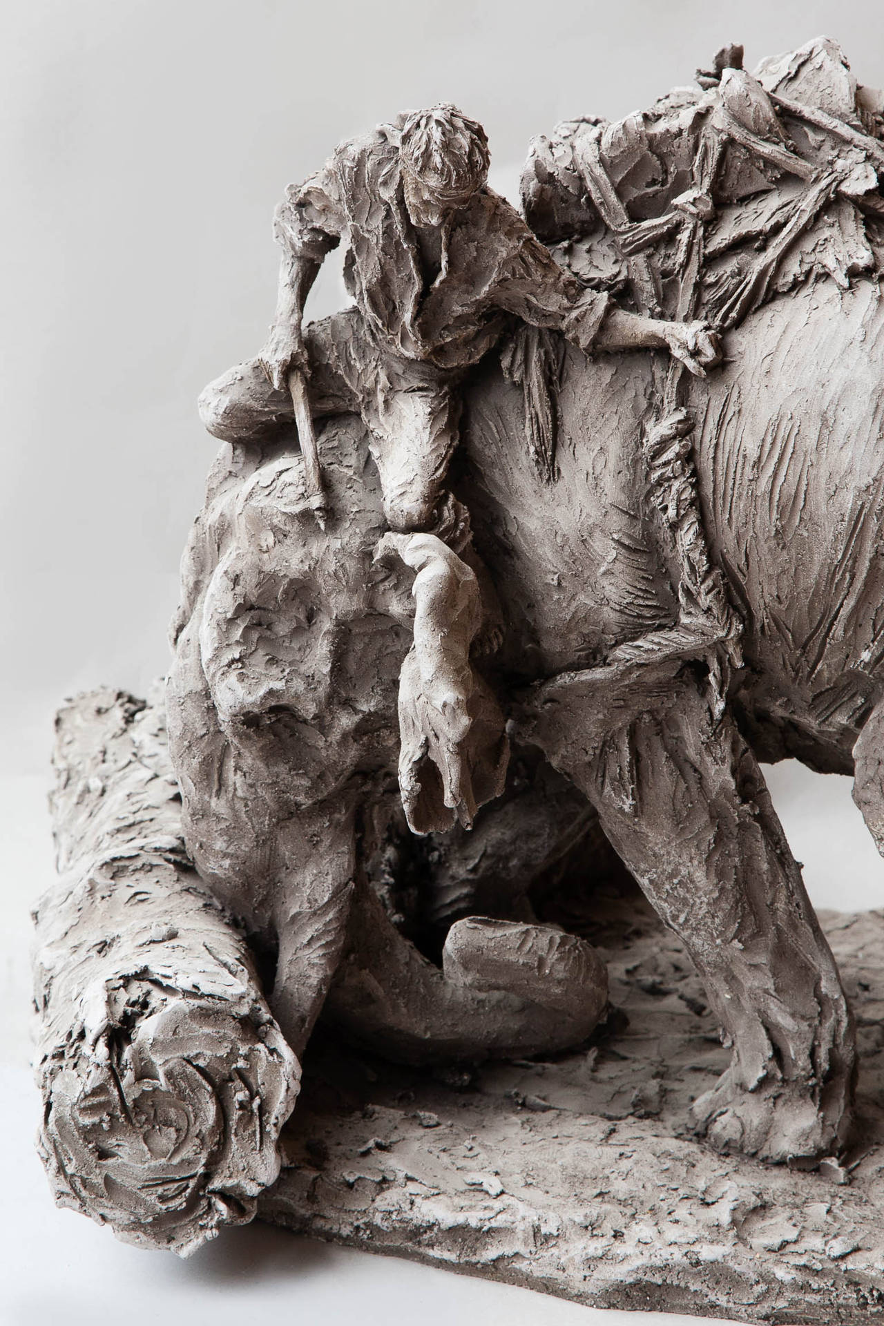 Matt unglazed faience sculpture of a Mahout riding an Indian elephant. By Jean-Paul Gourdon