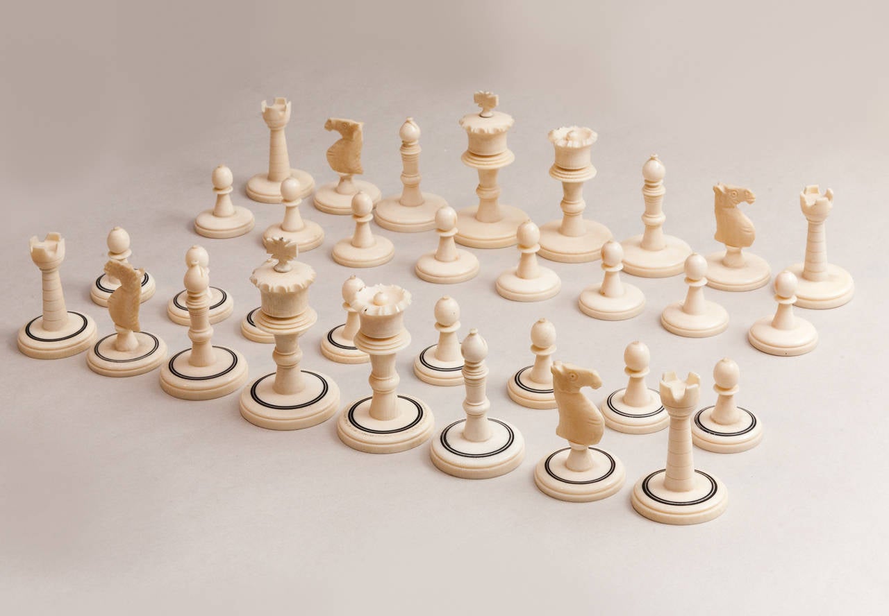 Both sides natural, one with applied back circles to the bases.

Please note: This chess set is subject to CITES license restrictions. A CITES license is required to export it outside the EEC. Please seek advice from your shipping agent.