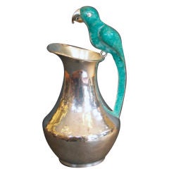 A Silver and Parrot Pitcher