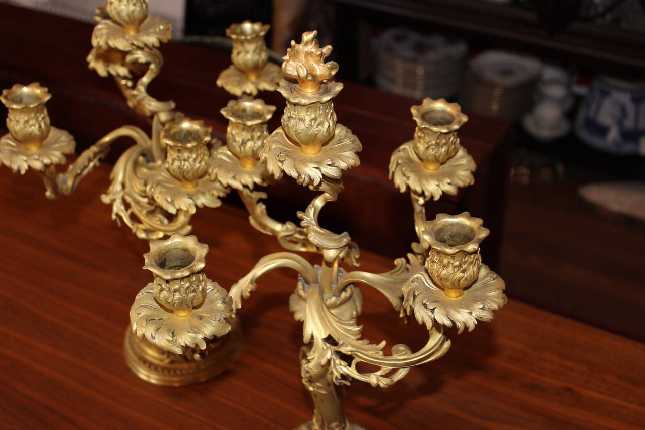 A Pair of Second Empire, Mid-19th Century French Gilt Fired Bronze Candelabra with flame finials.  From the Embassy of Morocco, Washington, D. C. Removable 
finials.